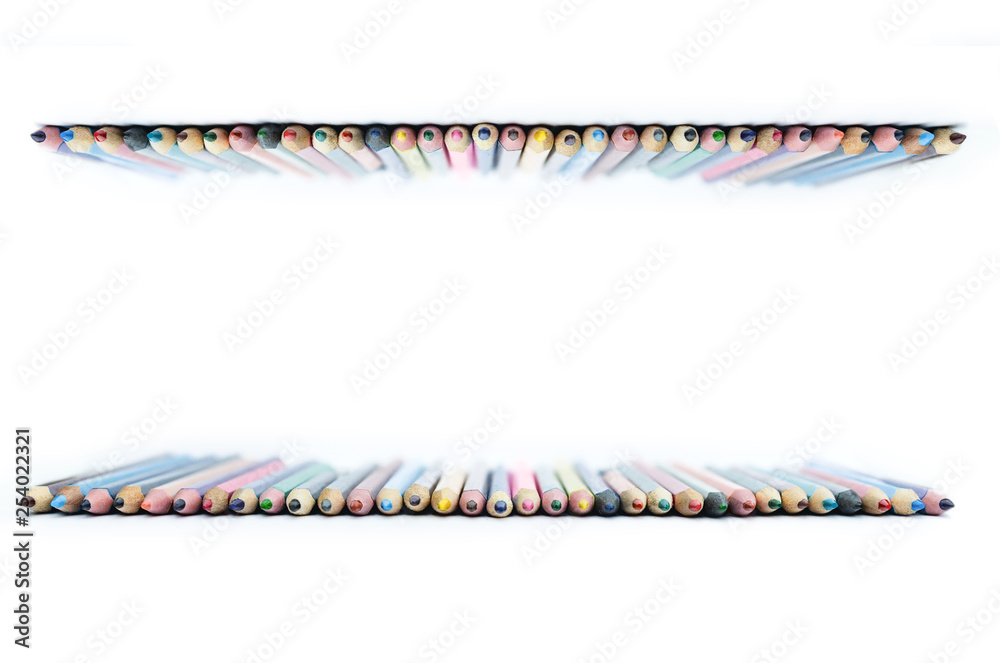 Obraz premium colored pencils laid out in a row, on a white background, will be printed, copy space, 