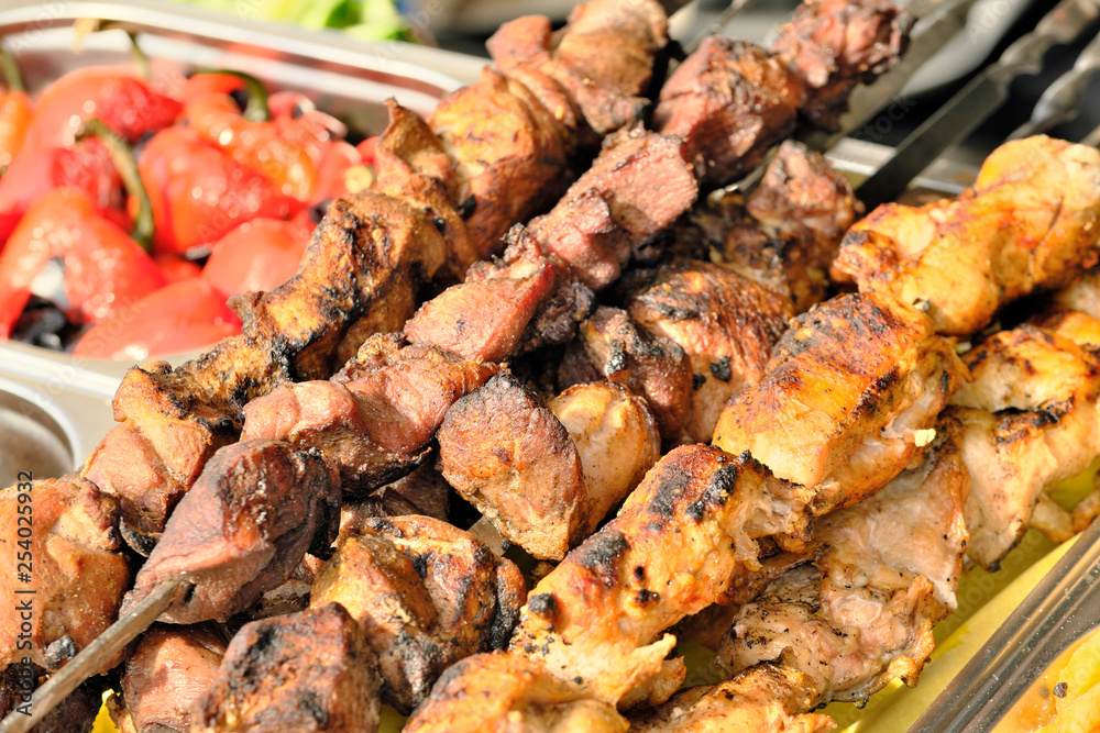 Meat on a skewer is grilled