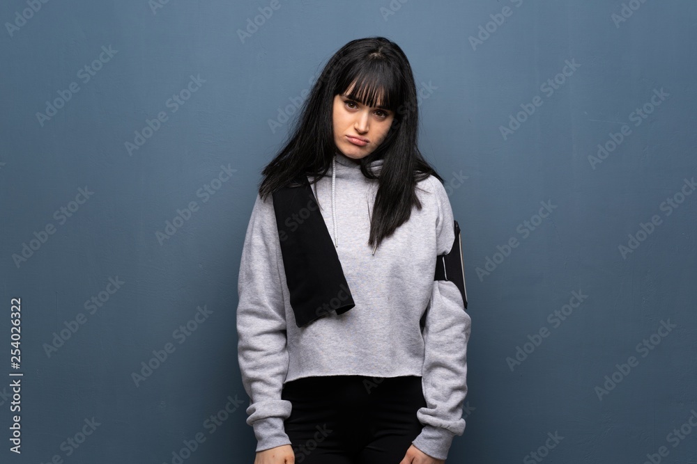 Young sport woman with sad and depressed expression