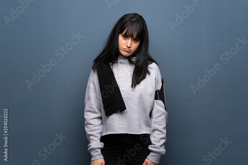 Young sport woman with sad and depressed expression © luismolinero