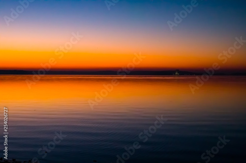 Incredible, bright sunset over the water. Minsk Sea, Belarus
