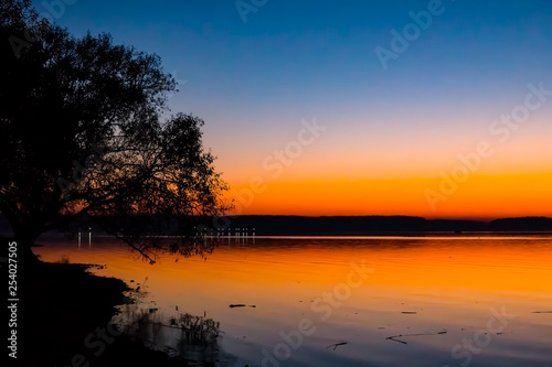 sunset over lake © Natallia
