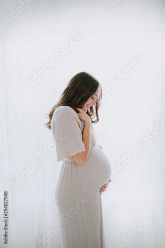 Pregnant Mother wearing Dress photo