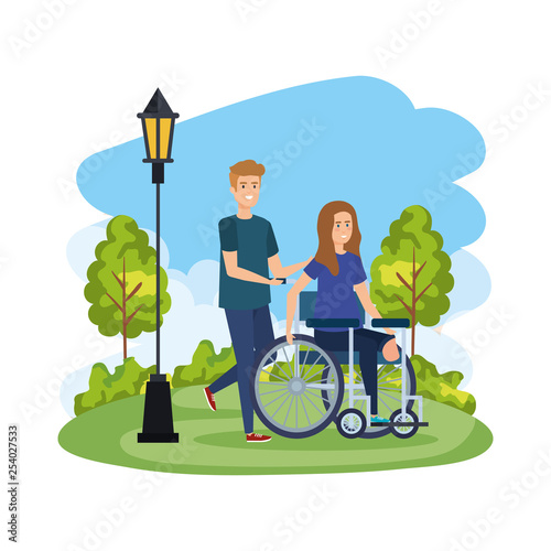 young woman in wheelchair with male helper