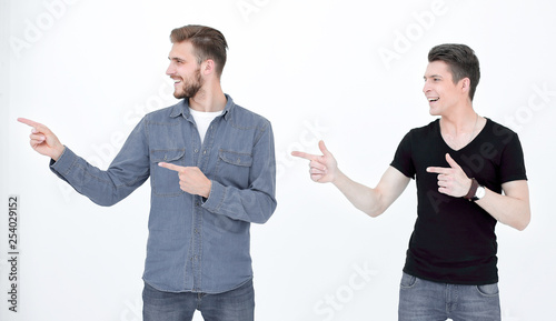 two friends stand and show on copy space