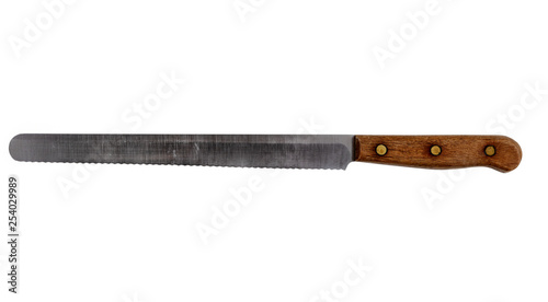 Vintage serrated steel kitchen knife isolated on a pure white background