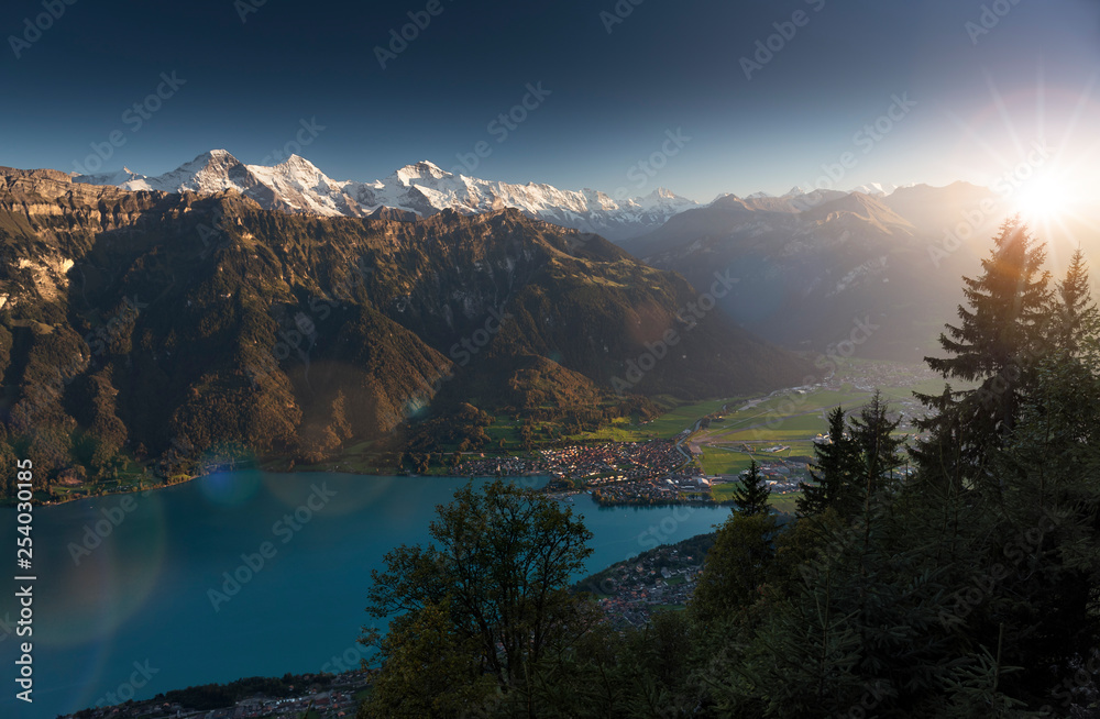 Idyllic view over Interlaken, Lake Brienz and the Swiss Alps during sunset, Eiger, Moench & Jungfrau, Bernese Oberland, Switzerland