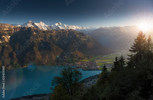 Idyllic view over Interlaken, Lake Brienz and the Swiss Alps during sunset, Eiger, Moench & Jungfrau, Bernese Oberland, Switzerland
