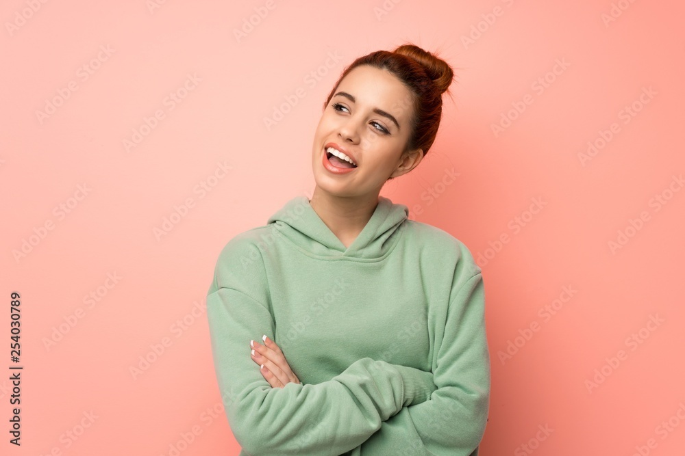 Young redhead woman with sweatshirt Happy and smiling Young redhead woman with sweatshirt Happy and smiling