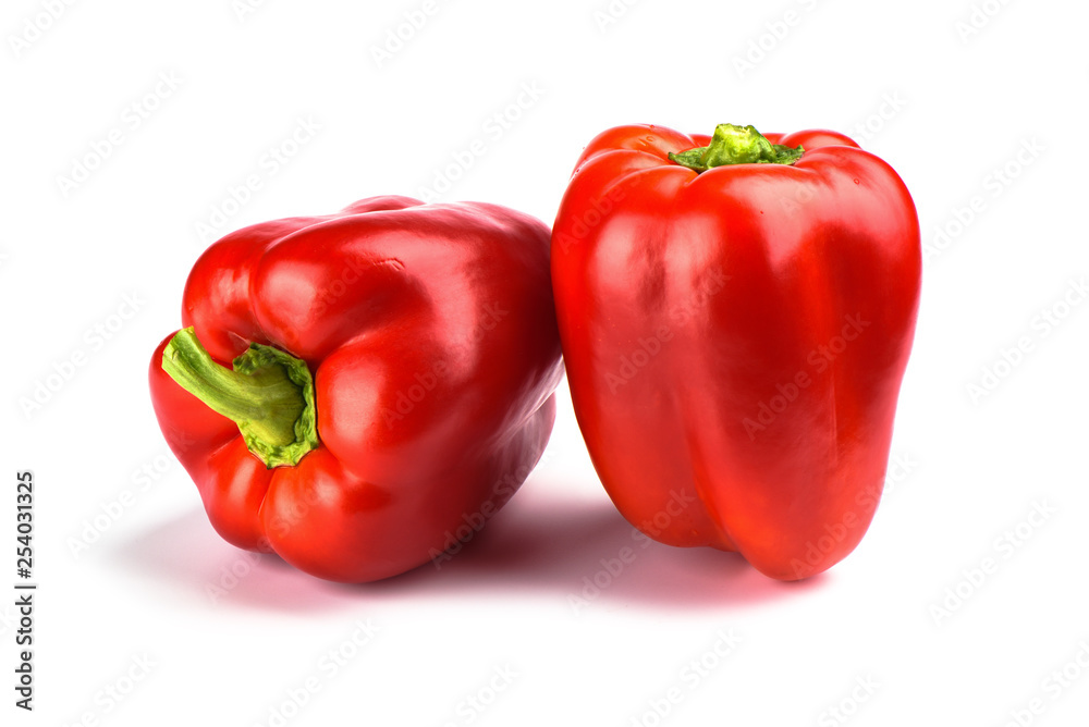 Two red bell peppers isolated on white background. Two red bell peppers isolated on white background.