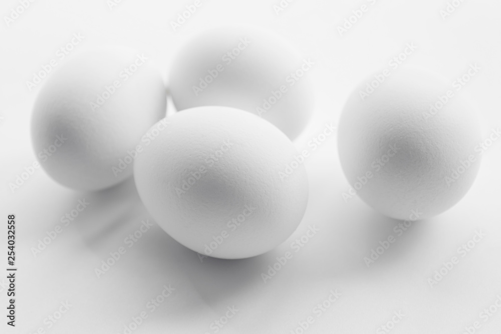 White boiled Easter eggs, uncolored on white background