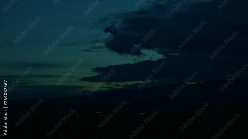 Beautiful dramatic sunset evening with fast moving clouds over town. Timelapse over Banska Bystrica, Slovakia, Central Europe. Darkening sky. Day to night lime lapse. Beautiful dramatic sunset evening with fast moving clouds over town. Timelapse over Banska Bystrica, Slovakia, Central Europe. Darkening sky. Day to night lime lapse.