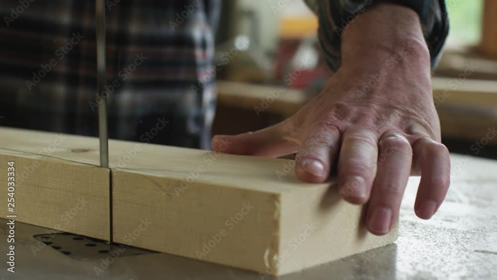 Carpenter at work cutting wood with circular saw close up slow motion Carpenter at work cutting wood with circular saw close up slow motion