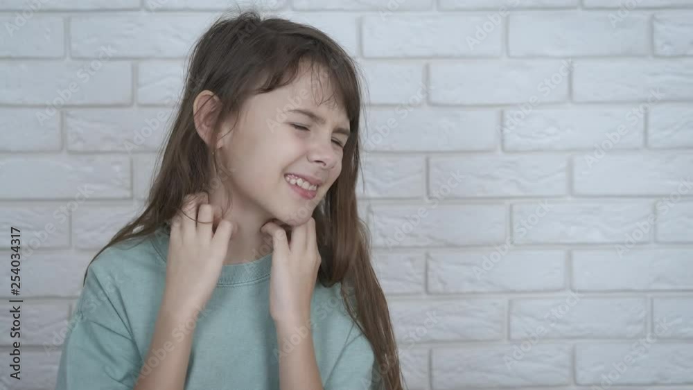 Allergy. The child has itching. The little girl scratches her neck and is nervous. Itching problem. Allergy. The child has itching. The little girl scratches her neck and is nervous. Itching problem.