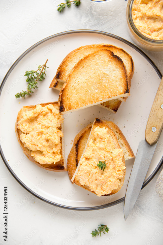Chicken pate with carrots on toast bread, delicious spread for Breakfast. Healthy food, vegetable snack, wine aperitizer Chicken pate with carrots on toast bread, delicious spread for Breakfast. Healthy food, vegetable snack, wine aperitizer