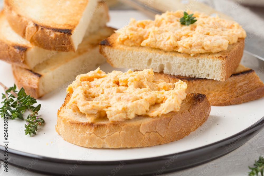 Chicken pate with carrots on toast bread, delicious spread for Breakfast. Healthy food, vegetable snack, wine aperitizer