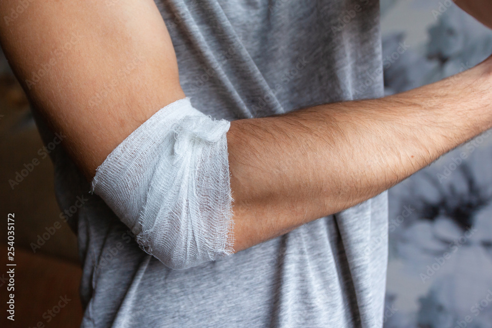 man's arm with bandaged elbow
