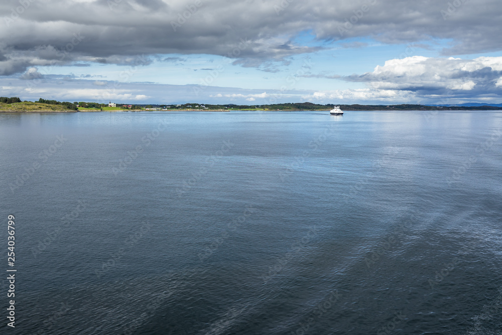 A ferry boat in the scenery landscape of Western Norway coastline
