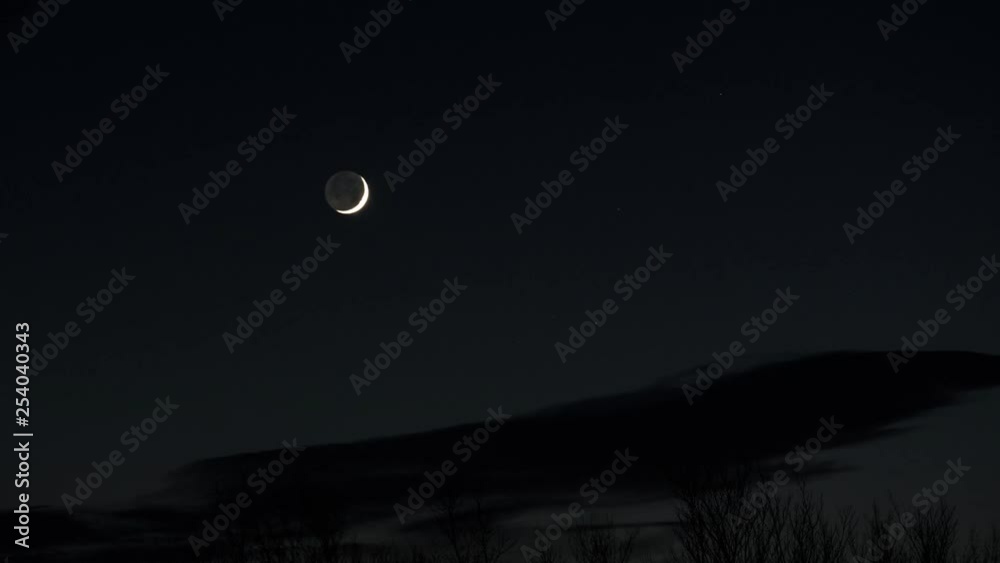 Timelapse of a Crescent moon wandering across the night sky. Timelapse of a Crescent moon wandering across the night sky.