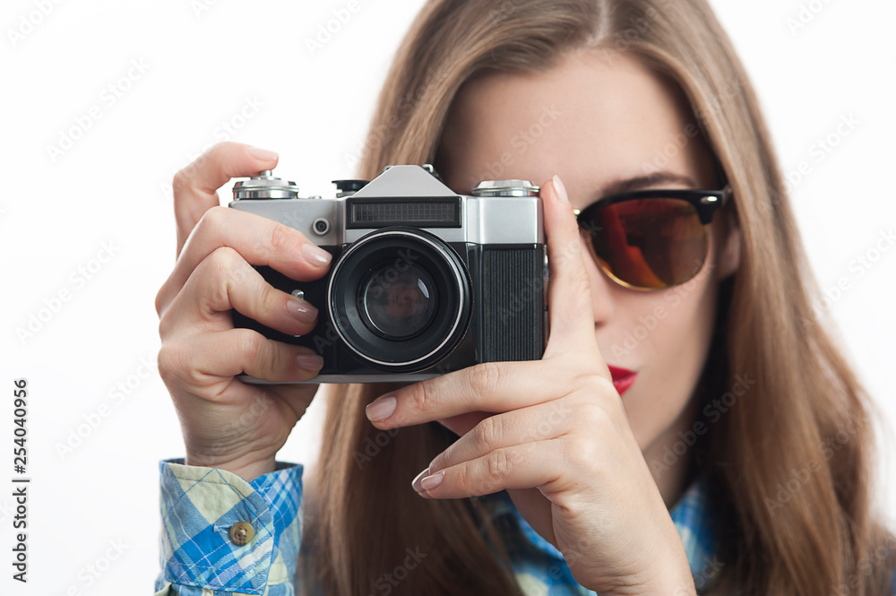 Young charming positive woman photographer with camera
