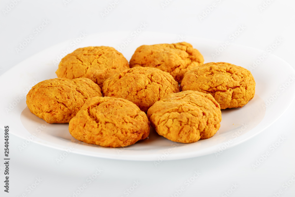 Classic homemade carrot cookies with peanut butter on a white background