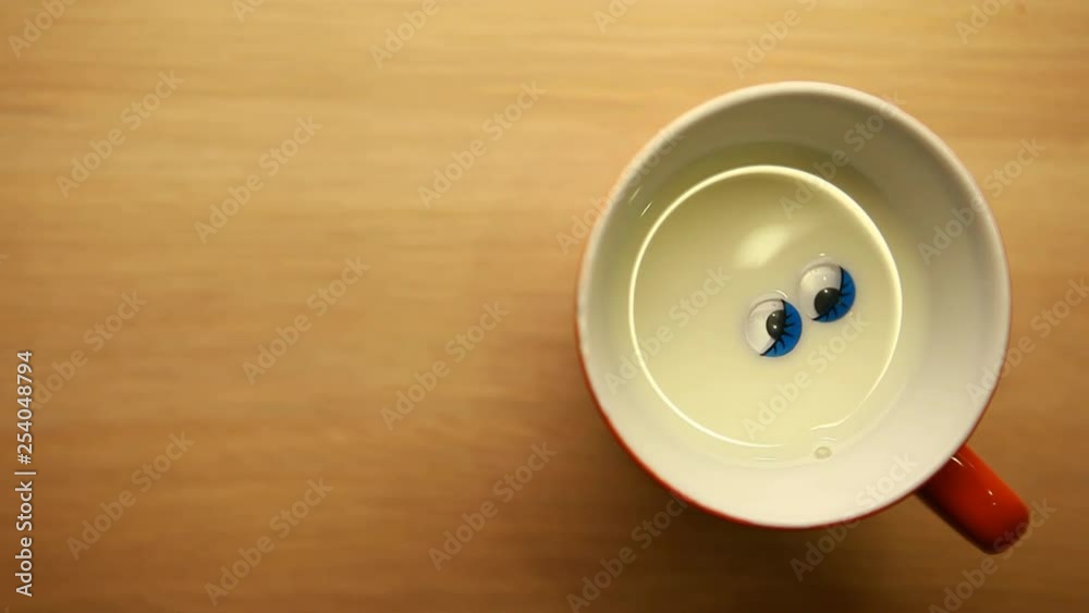 milk mug blue plastic eyes wooden table nobody hd footage milk mug blue plastic eyes wooden table nobody hd footage