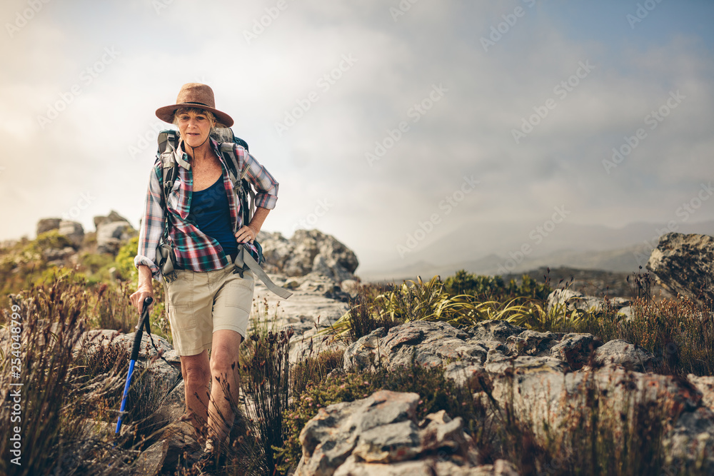 Senior woman on an adventurous hiking trip