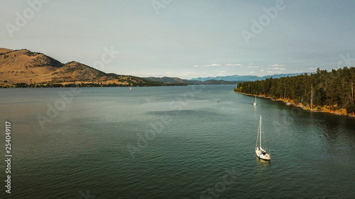 Aerial View of Flathead Lake in Montana with Sail Boat and Mountains