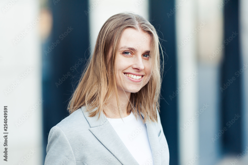 Fototapeta premium Blonde young smiling businesswoman