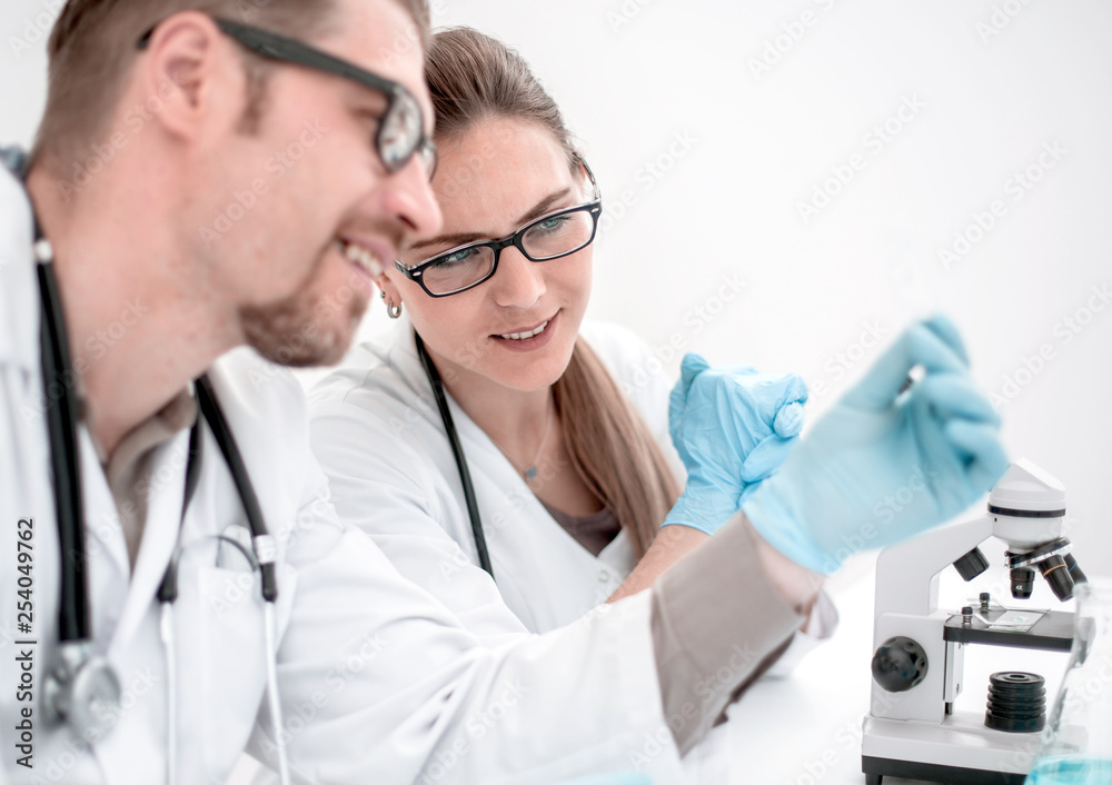 two scientists are conducting tests in the laboratory two scientists are conducting tests in the laboratory