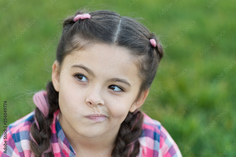 thoughtful small girl looking for idea what to do. Parks and outdoor. summertime. Small girl with trendy hair. happy childhood. Flying of thoughts. Looking for inspiration. Young and full of ideas thoughtful small girl looking for idea what to do. Parks and outdoor. summertime. Small girl with trendy hair. happy childhood. Flying of thoughts. Looking for inspiration. Young and full of ideas