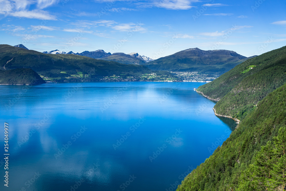 Sky reflecting on the smooth water surface of Storfjorden in Sunnmore region, More og Romsdal, Norway Sky reflecting on the smooth water surface of Storfjorden in Sunnmore region, More og Romsdal, Norway