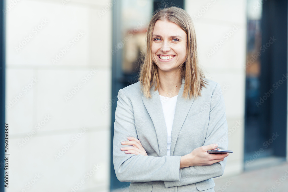 Beautiful young businesswoman using smartphone Beautiful young businesswoman using smartphone
