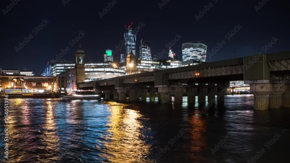 Cannon Street Railway Bridge at night with City skyline in background, time lapse, London, GB Cannon Street Railway Bridge at night with City skyline in background, time lapse, London, GB