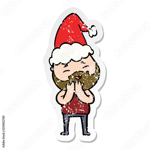 distressed sticker cartoon of a happy bearded man wearing santa hat