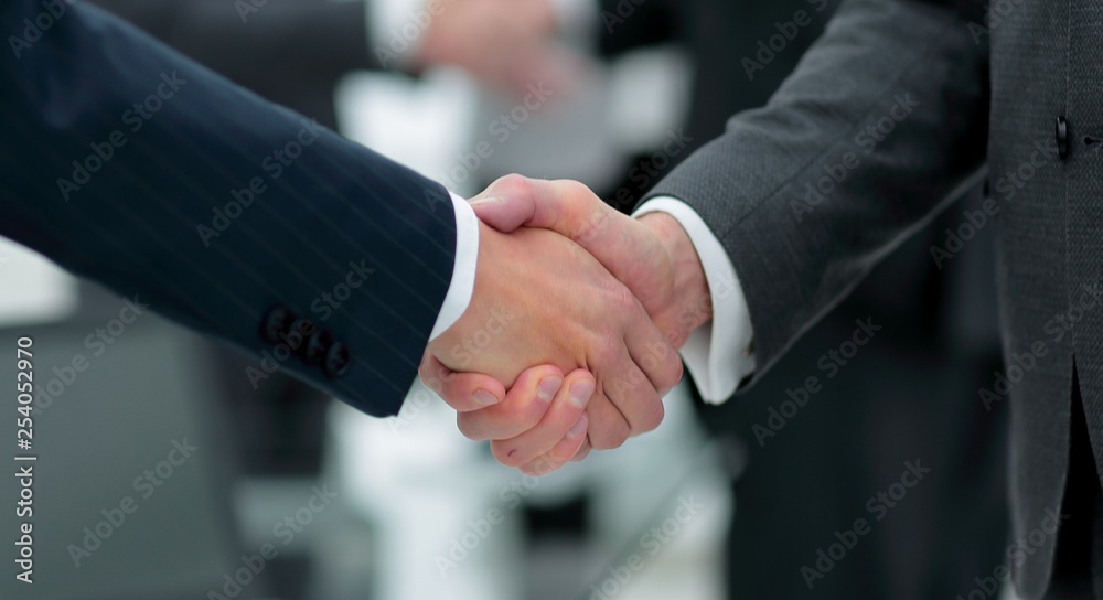 concept of cooperation.handshake of business partners