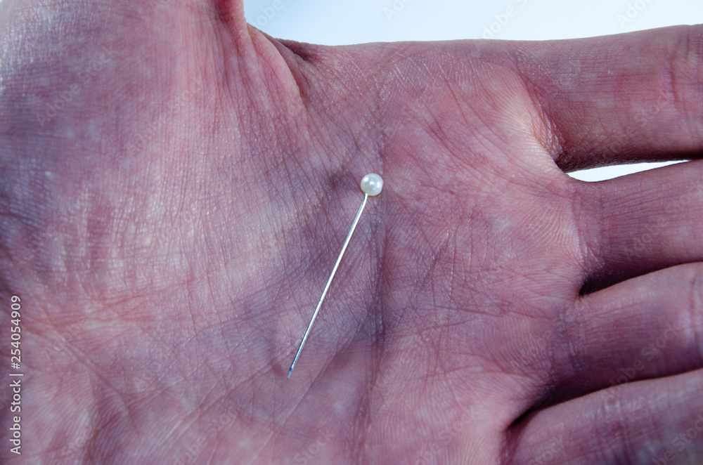 Needle invisible with colored ends in their hands Needle invisible with colored ends in their hands