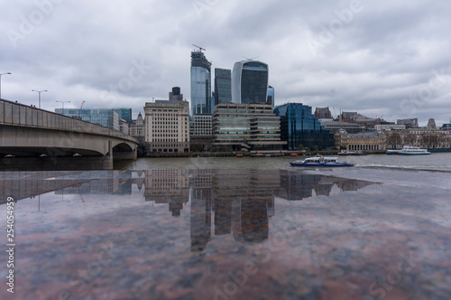 A view across the River Thames from City Hall, London, UK towards the City of London