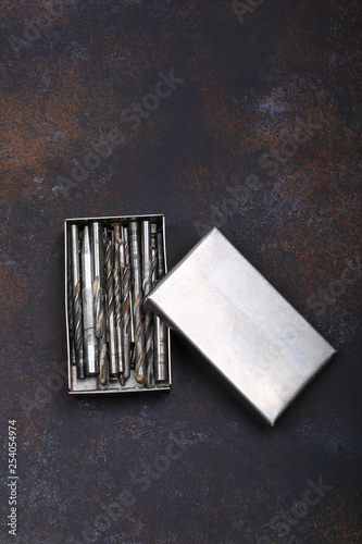 set of drill bits for drills on a vintage background