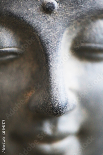 Buddha face close up shot. Buddhist religion concept idea