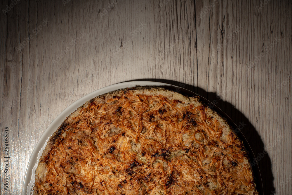 Homemade apple pie dessert on a wooden table closeup.