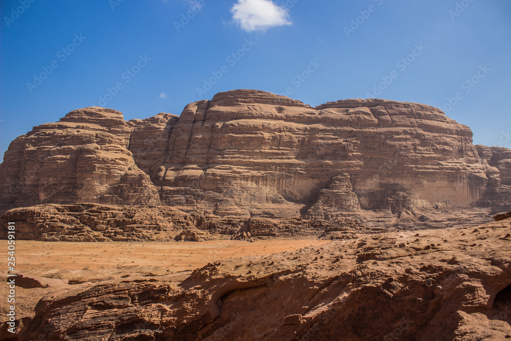 Wadi Rum Jordan Middle East country rocky desert scenery environment landscape heritage place with steep bare mountain ridge background, picturesque panorama touristic photography  