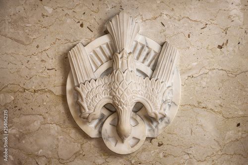 Carved marble dove symbol of the Holy Spirit of God at the tabernacle of a Toronto Roman Catholic church photo