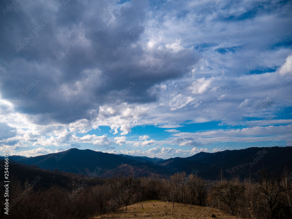 Beautiful landscape in the mountains at sunset. View of colorful sky with amazing clouds. Beautiful landscape in the mountains at sunset. View of colorful sky with amazing clouds.