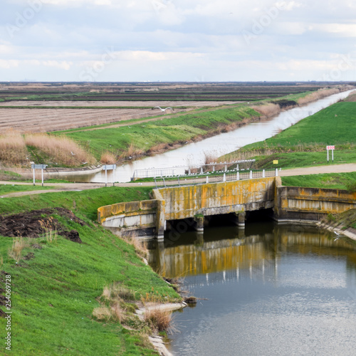 Bridges through irrigation canals. Rice field irrigation system