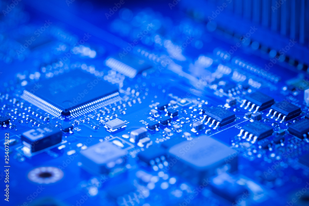 Close Up - Chip in a computer circuit board motherboard Close Up - Chip in a computer circuit board motherboard