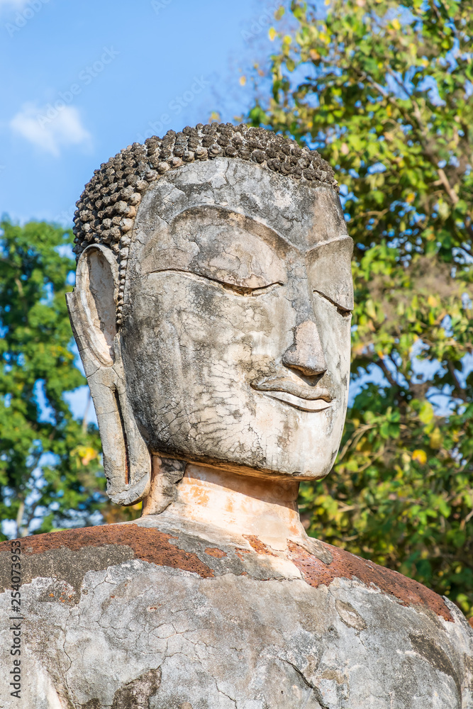 Sitting Buddha statue at Wat Phra Kaeo temple in Kamphaeng Phet Historical Park, UNESCO World Heritage site