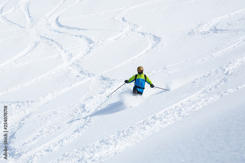 Telemark skiing on powder slope with few ski tracks in Hokkaido