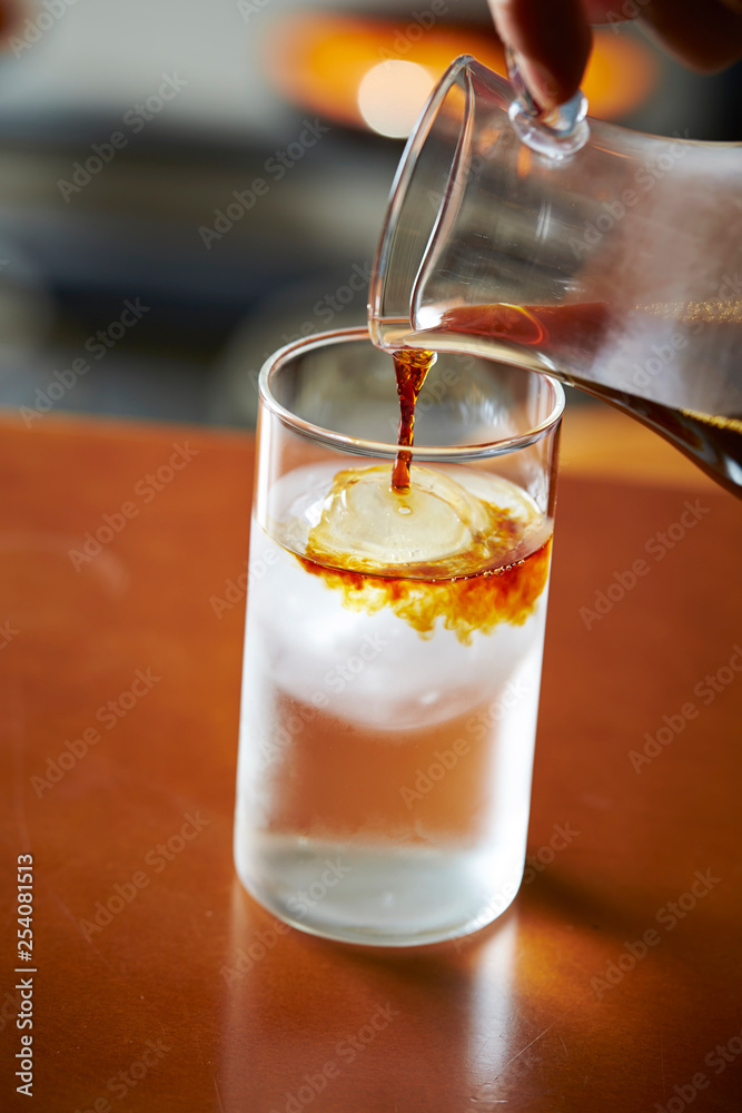 Pouring coffee in iced water Pouring coffee in iced water