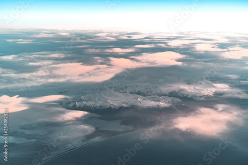 Aerial view of sunrise in winter nature landscape in north Iceland with glaciers in background. Snow Capped mountains and Glacier.